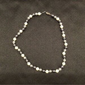 Cultured freshwater pearl necklace in white, grey, and black
